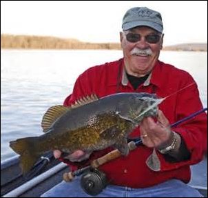 Chartreuse and white Clouser's Minnow saltwater fly fishing streamer