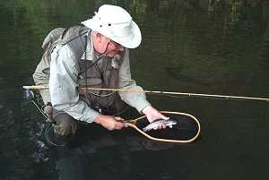 Customer Bob Olach fishing in the Kickapoo River